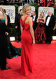 Stacey Keibler, por detrás, en los Globos de Oro 