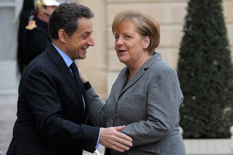El Presidente Francés, Nicolas Sarkozy, Y La Canciller Alemana, Angela Merkel