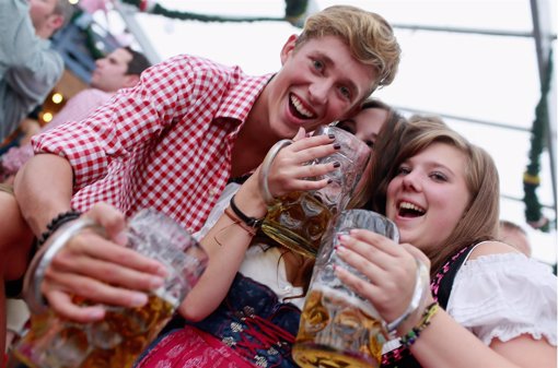 MUNICH, GERMANY - SEPTEMBER 23:  Revellers, dressed with traditional Bavarian cl